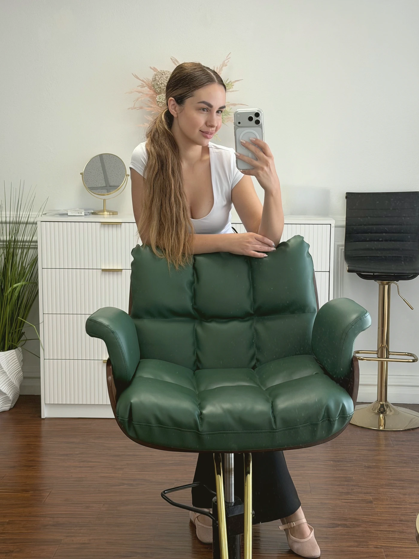 Inna in the HBI Studio room, behind the green styling chair